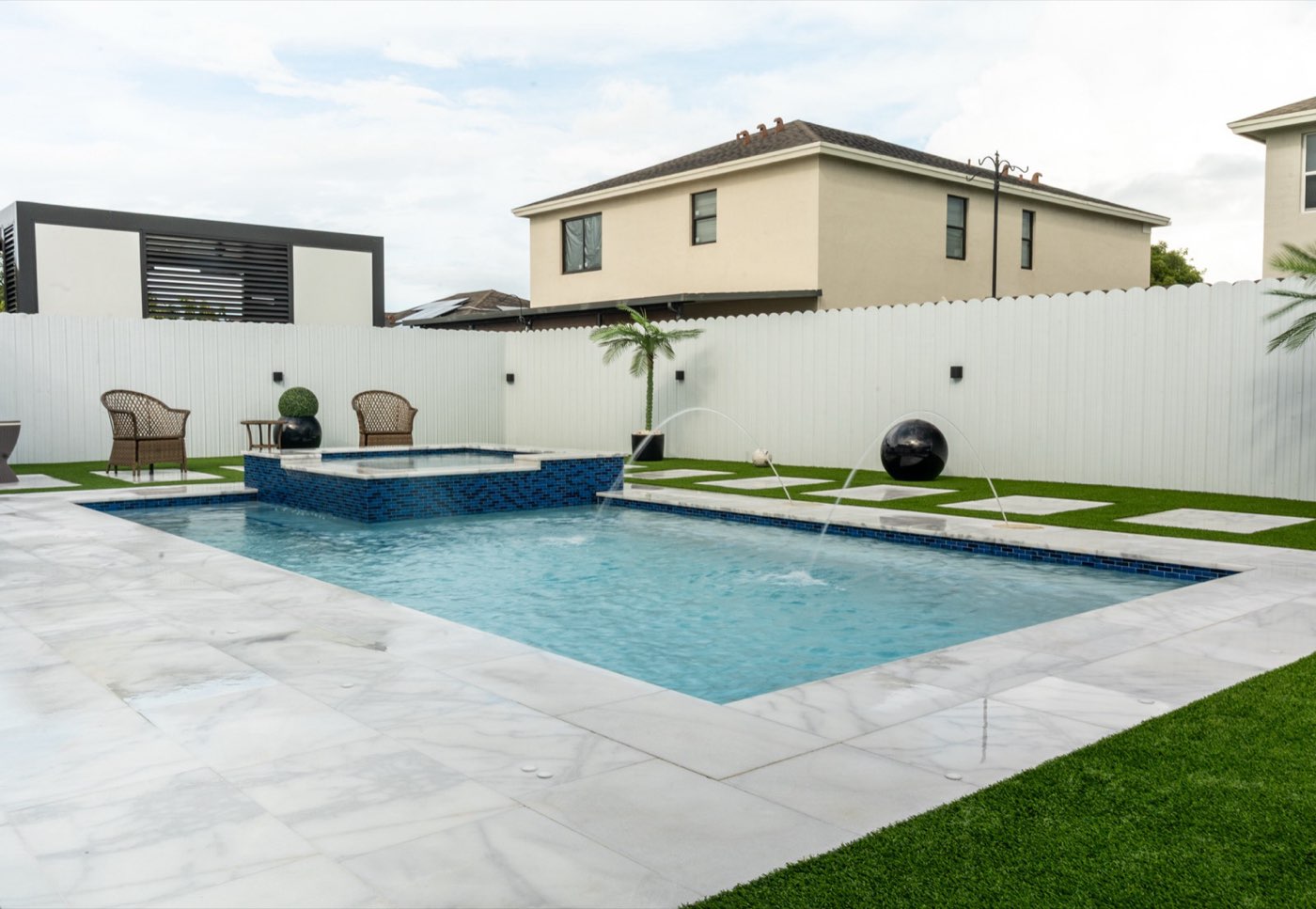 Custom pool construction with marble deck and landscaping in Homestead, Miami-Dade — Florida Blue Waters