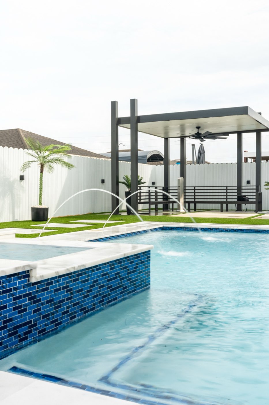 Custom pool with pergola, deck jets, and artificial turf in Kendall, Miami — Florida Blue Waters
